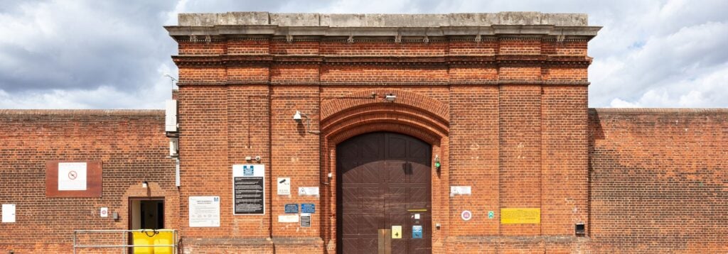 A panoramic view of Norwich Prison's exterior, including its modern and historical facilities.