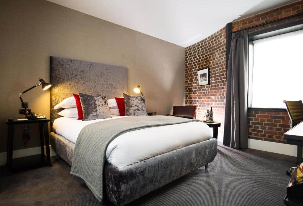 Luxurious cell room at Malmaison Oxford Prison Hotel with modern amenities.